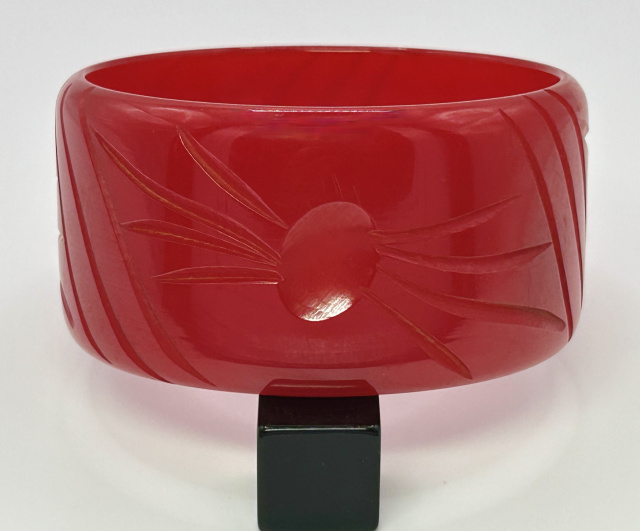 vintage wide red slash carved bakelite bangle